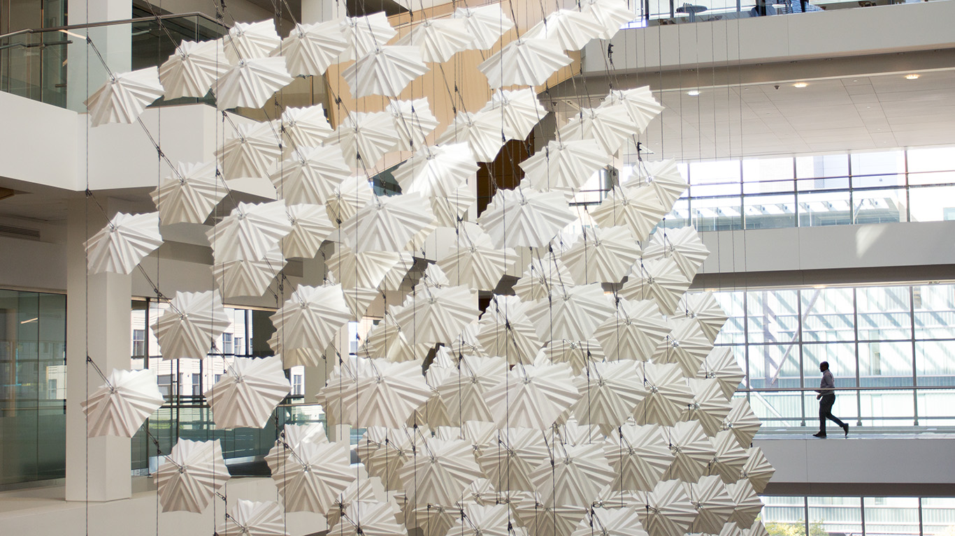 The graceful movements create an open, contemplative space for passerbys to enjoy.